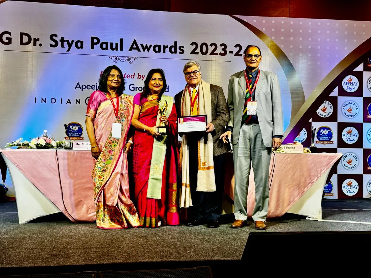 Dr. Nandita Palshetkar receiving a lifetime achievement award